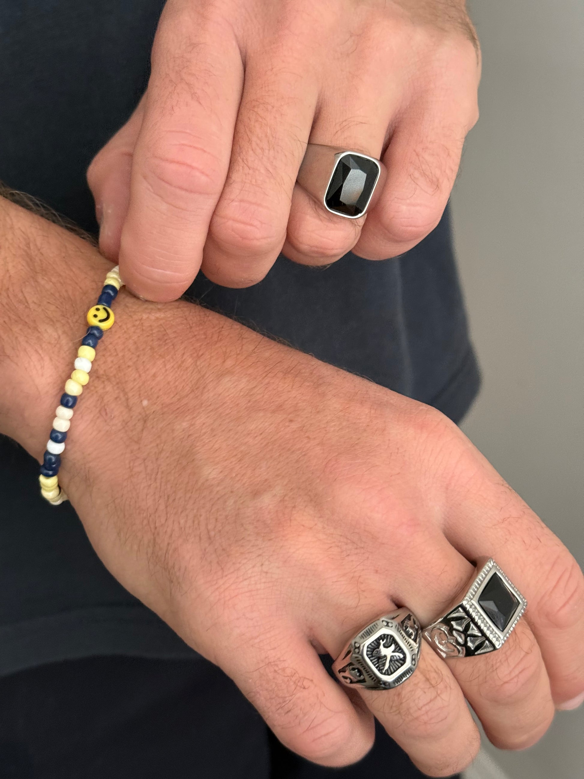 This trendy men's ring is made of stainless steel material. It’s subtle yet an eye-catcher with its beautiful stone in the center. You can wear it on any finger, depending on your size. Great to pair with our other men's jewelry (bracelets, necklaces) or to stack with other rings.